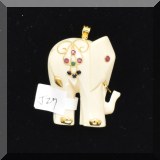 J027. 14K yellow gold bone elephant pendant with red, green and blue stones 1.75” - $65